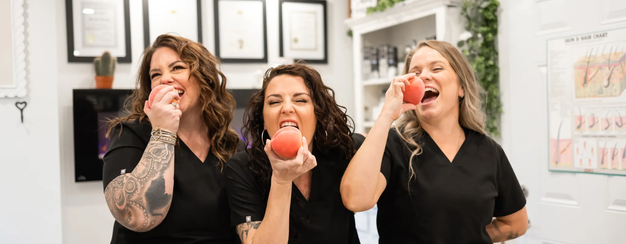 3 of us taking a bite of a fuzzy peach 